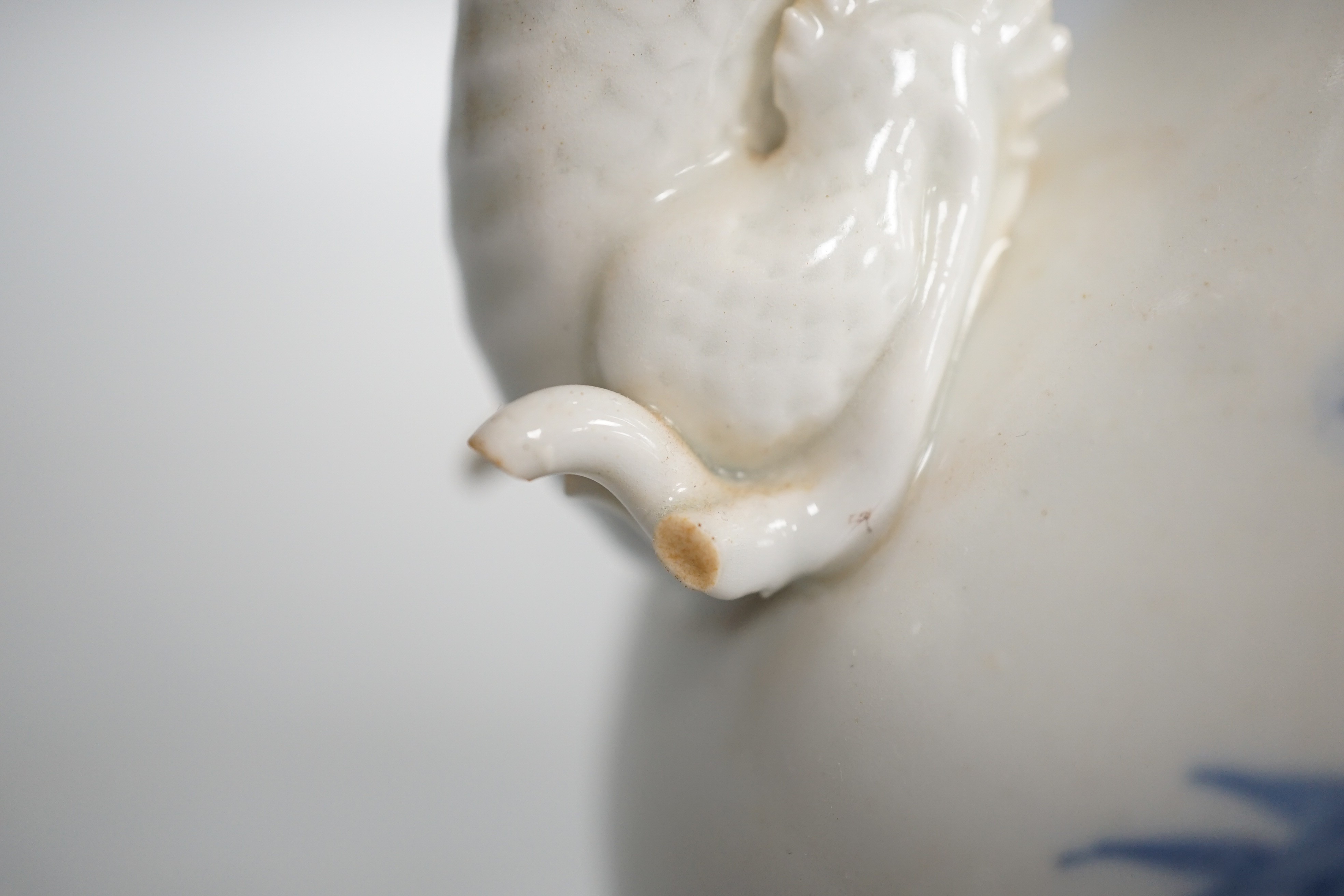 A Japanese Hirado blue and white 'dragon' wine pot, late 19th century, of double gourd shape, (losses) 19.5cm